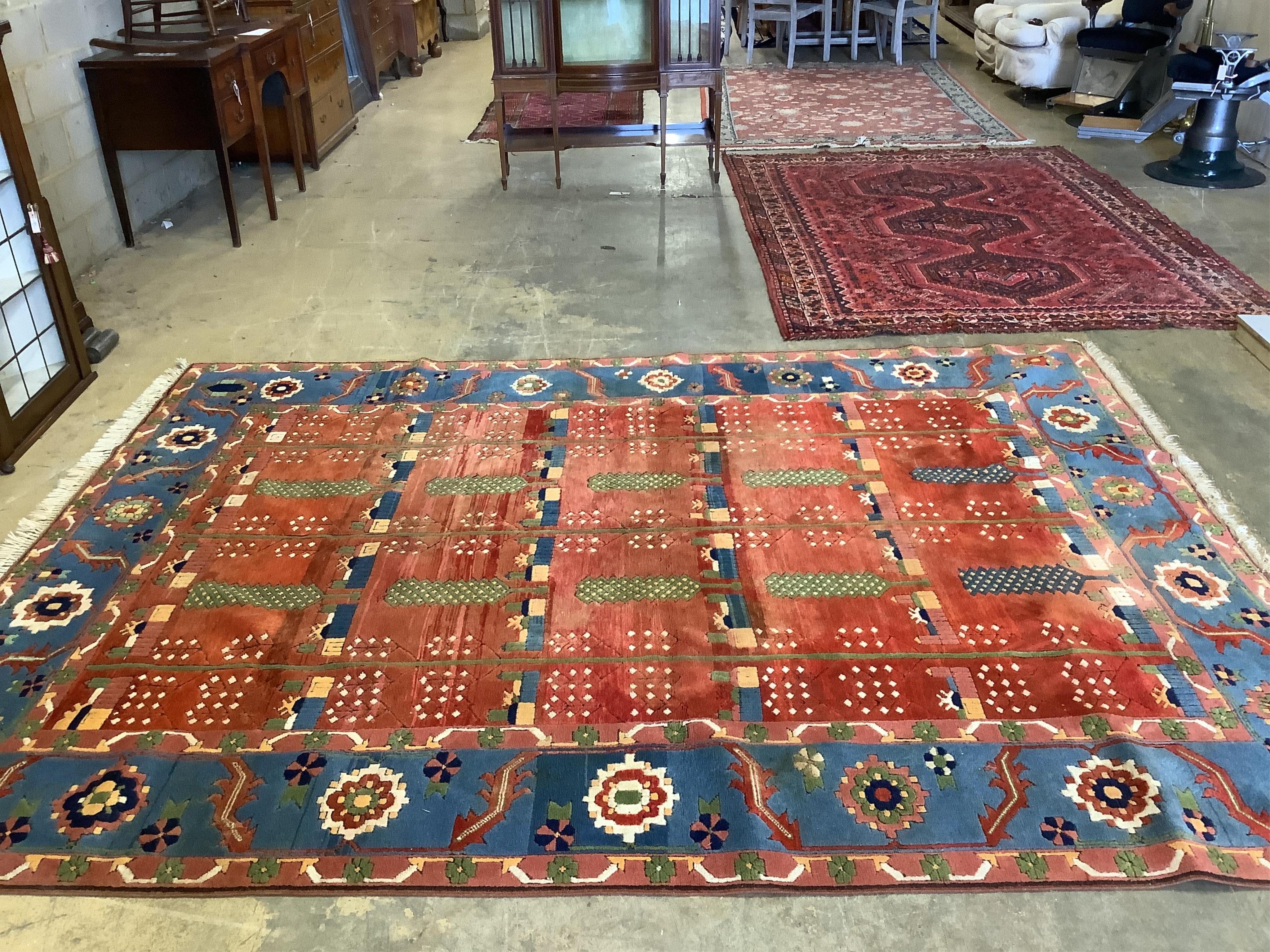 A modern Caucasian red ground carpet, 335 x 252cm. Condition - looks good but needs a clean due to dog odour